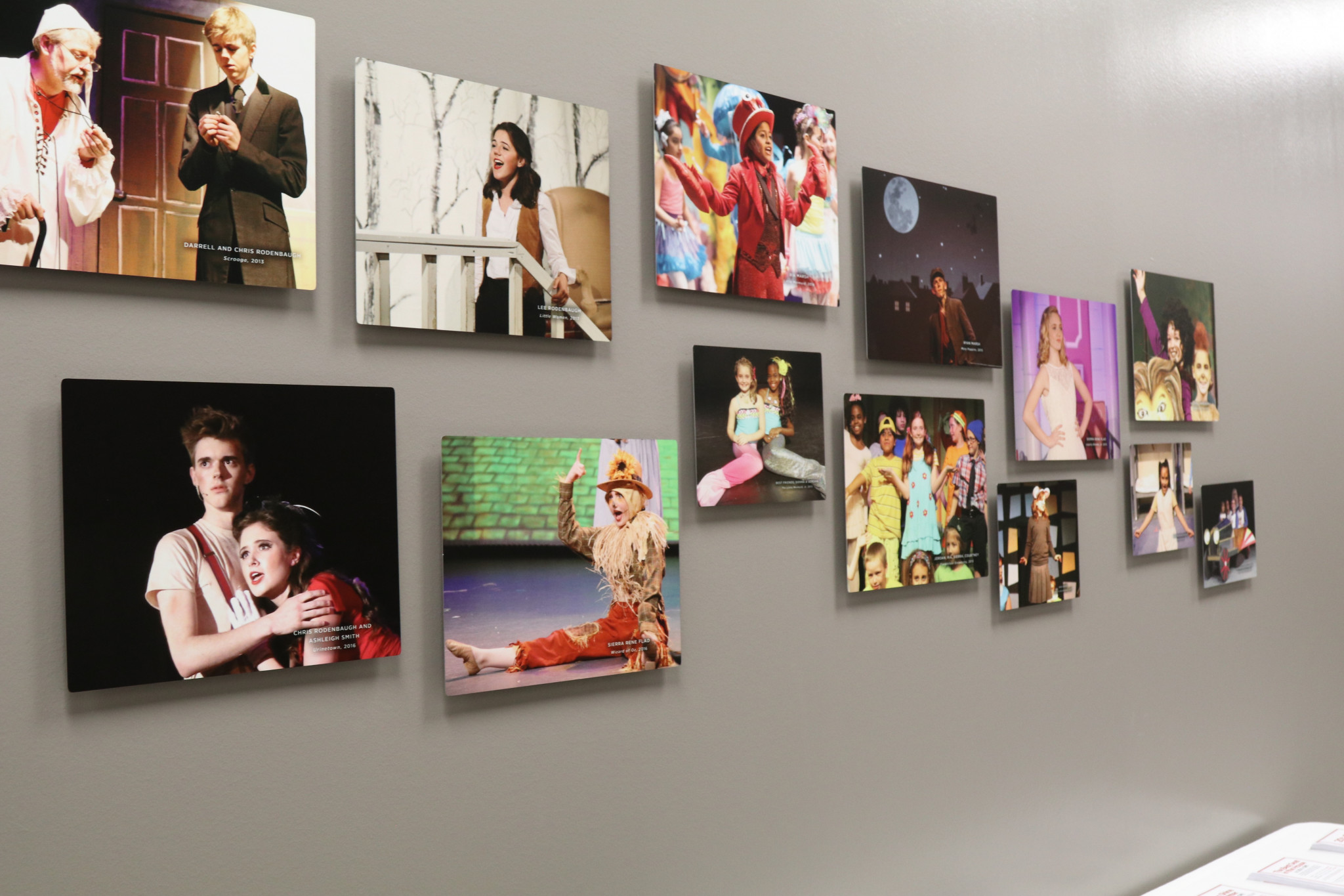 NTPA photo gallery wall featuring photos of students from past productions