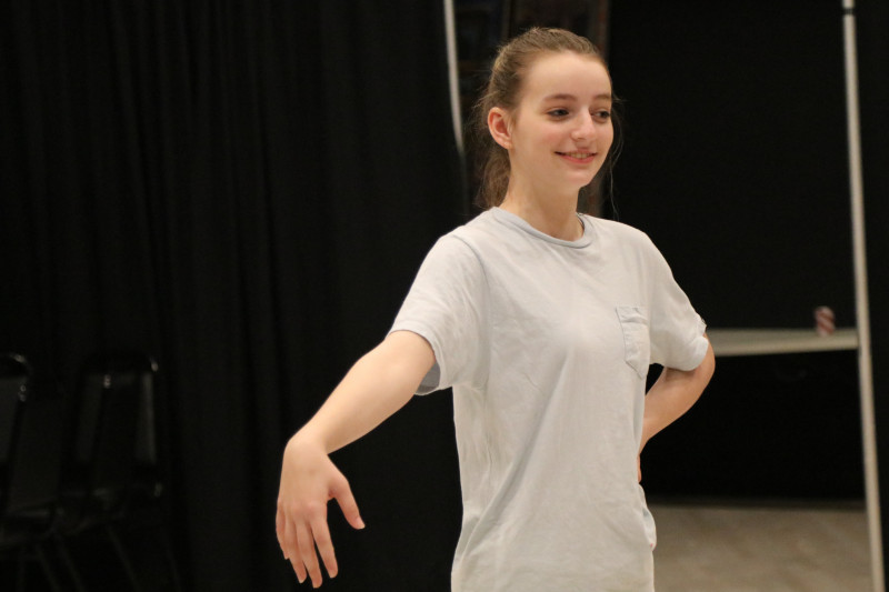 A picture of an North Texas Performing Arts student participating in a workshop class for the Academy.