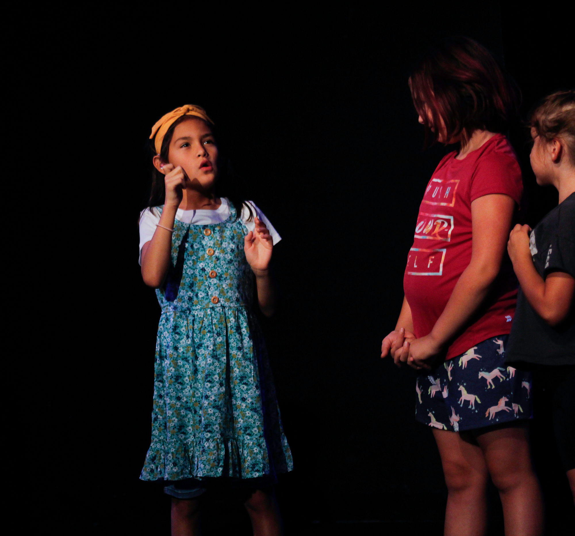 Students sign ASL while performing in Deaf theatre class