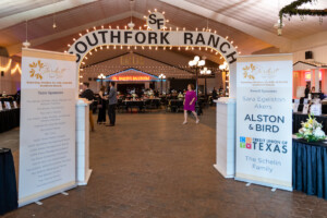 Sponsor banners sit in front of the Southfork Ranch archway at the entrance to the 2022 Stardust awards