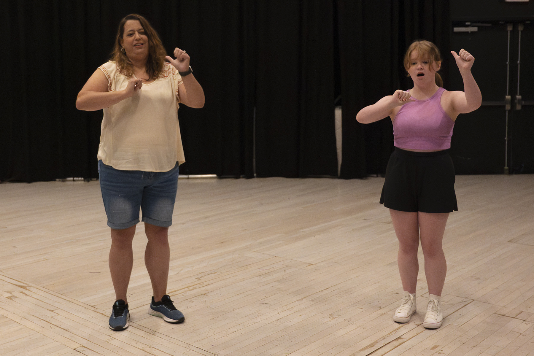 2023 Deaf Theatre Showcase two actresses sign ASL during "No Business" scene